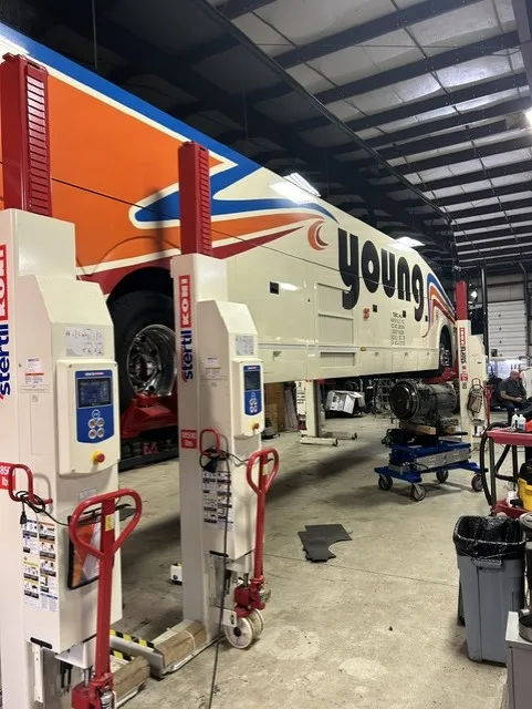 A Young Transportation motorcoach inside the Asheville maintenance shop